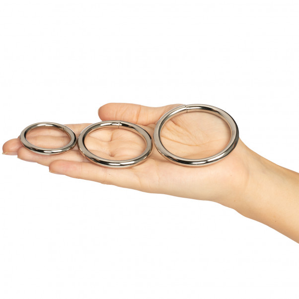 Spartacus Metal Cock Ring Pack of 3  product held in hand 50